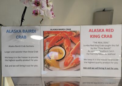 Photo of Alaska Bairdi & Red King crab signage Fall City Meats and Seafood